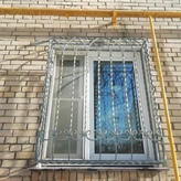 кованая решетка с трассировкой дутой формы